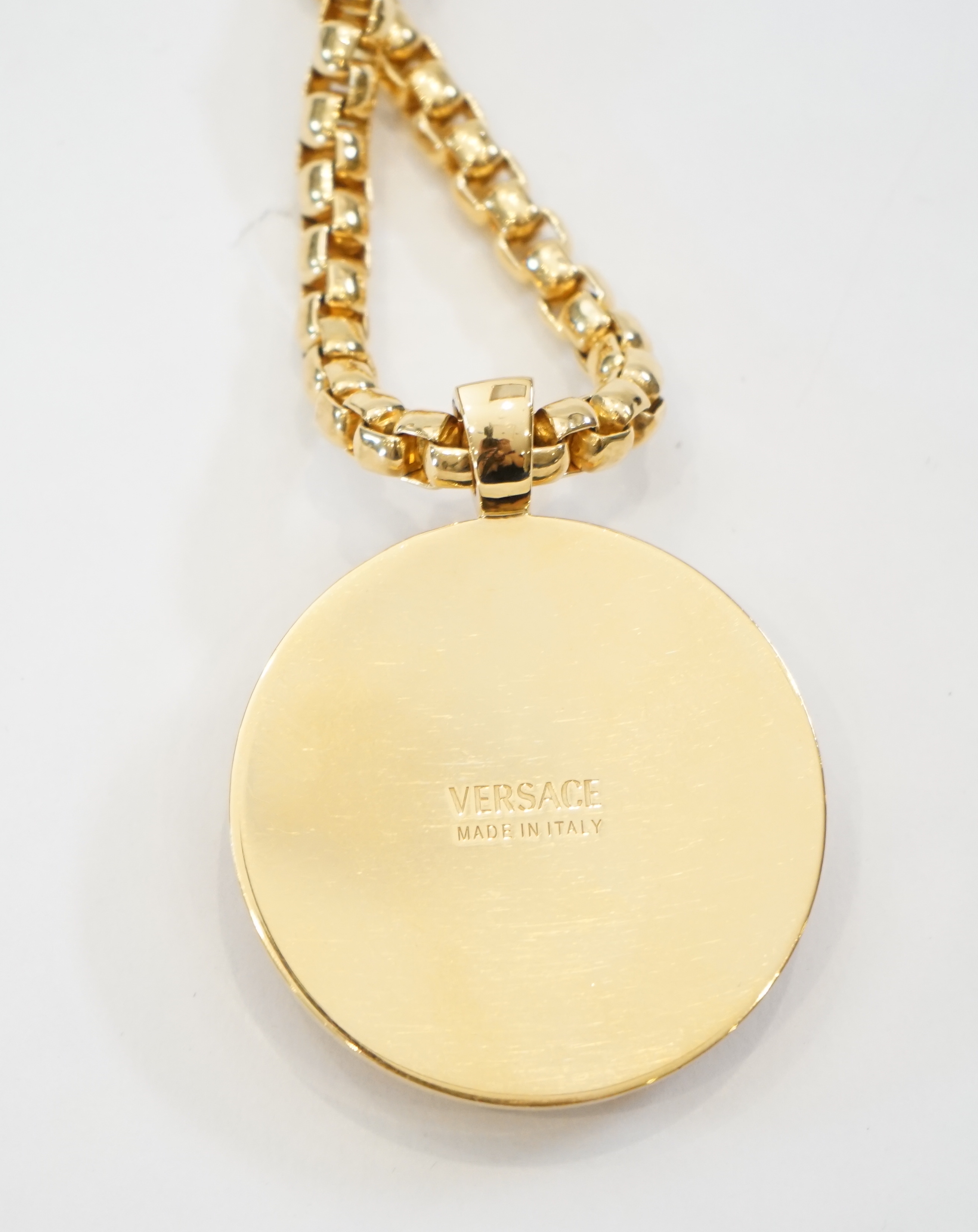 A Versace Medusa gold Greca medallion coin pendant with chunky rapper necklace, chain full length 64cm, medallion 5cm across